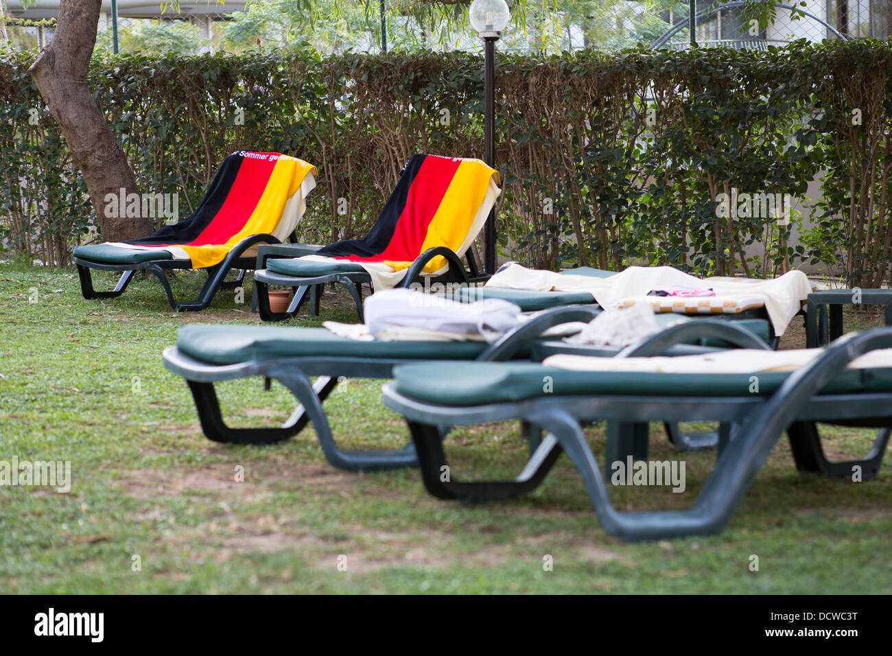 towels-in-the-colours-of-the-german-flag-are-used-to-reserve-sun-loungers-DCWC3T.jpg
