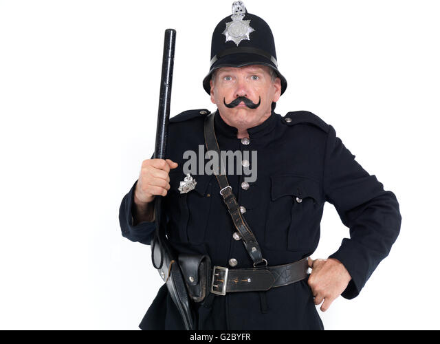 vintage-policeman-with-a-strict-face-holding-a-baton-g2byfr.jpg