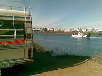 Boat passes Hymer outside Tavira.jpg