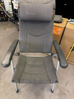 A pair of used Isabella Thor reclining camping chairs in light grey with headrests