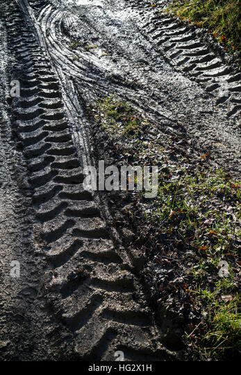 tractor-tracks-in-lane-track-farm-tire-tread-plow-plowed-land-farming-hg2x1h.jpg